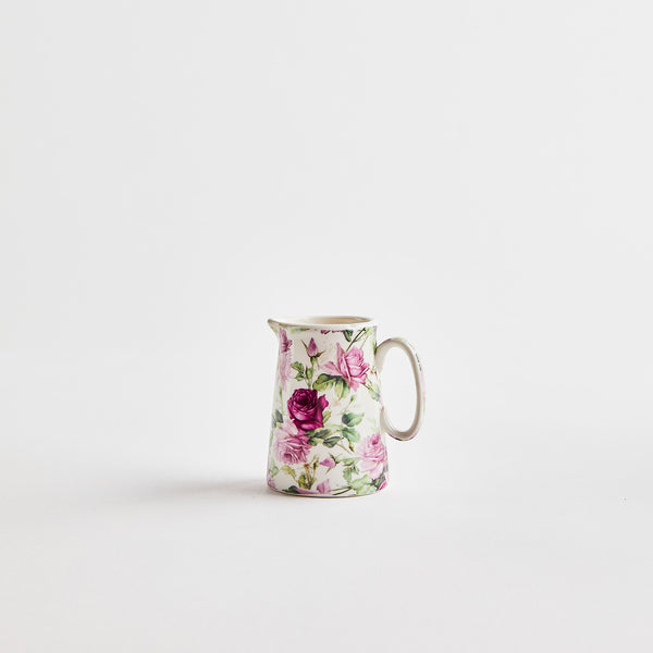 White jug with floral detail.