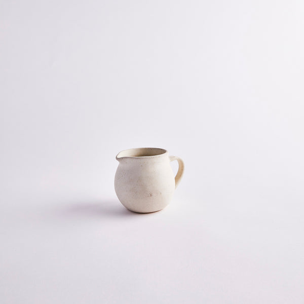 Cream ceramic jug.