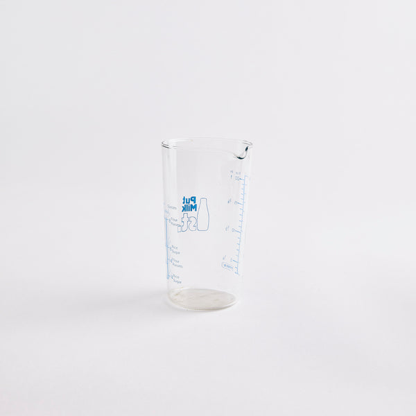 Clear milk glass measuring jug.
