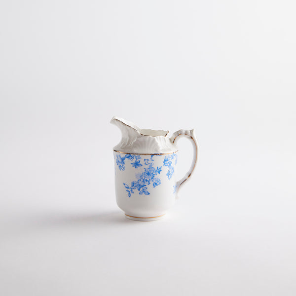 White jug with blue floral detailing.