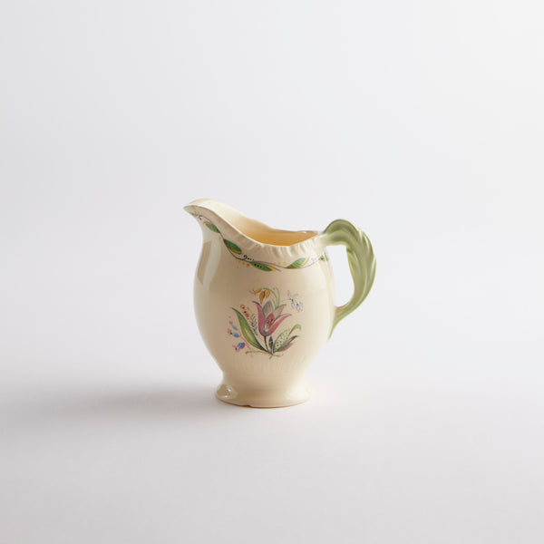 Cream jug with multi floral detailing.