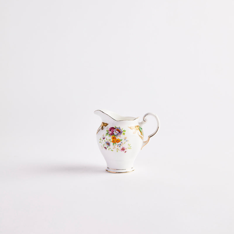White jug with multi colour floral detail.