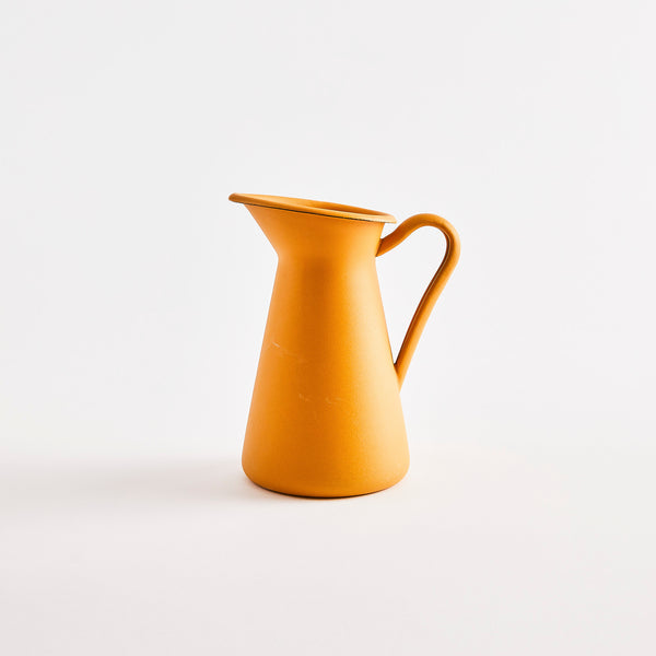 Yellow metal jug.