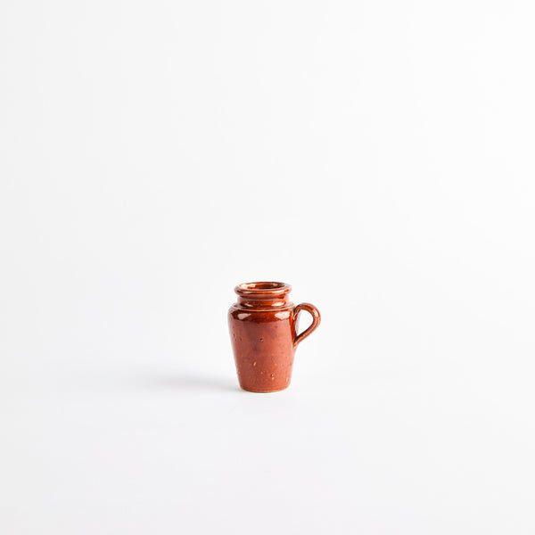 Brown ceramic jug.