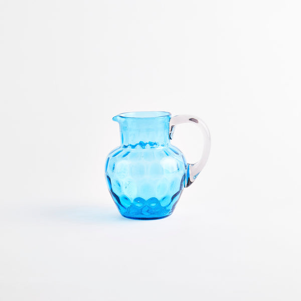 Blue glass jug.