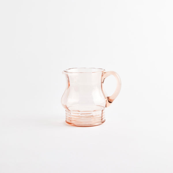 Pink glass jug.