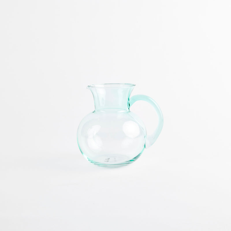 Green glass jug.