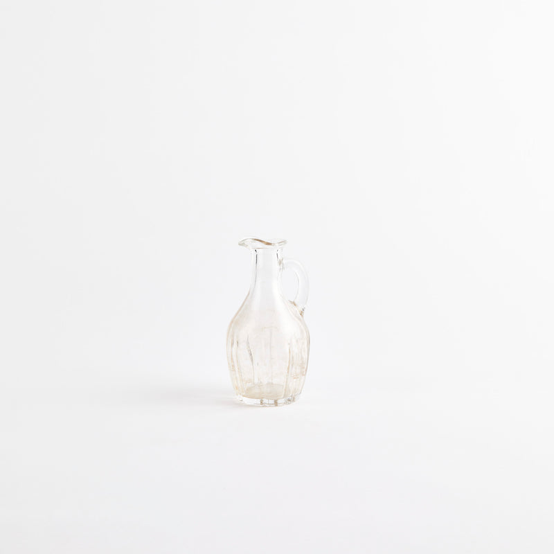 Clear glass jug.
