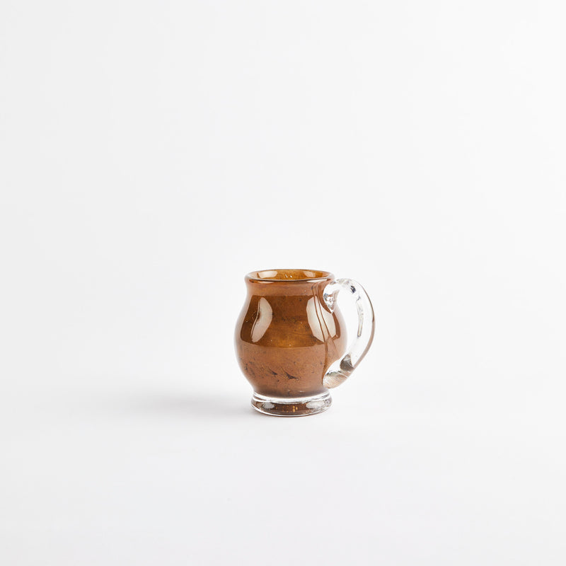 Brown glass jug.