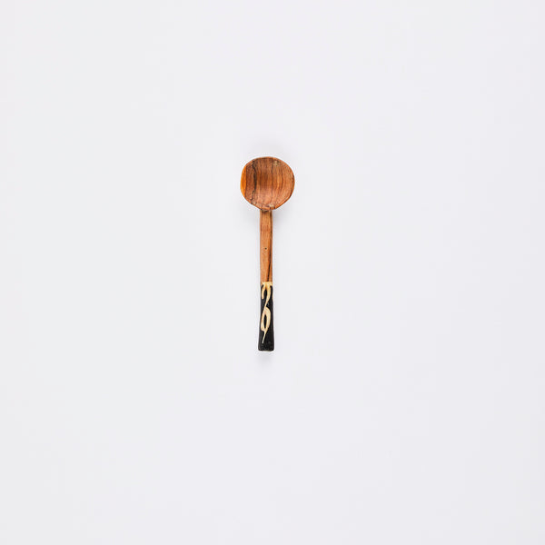 Wooden spoon with tribal print handle.