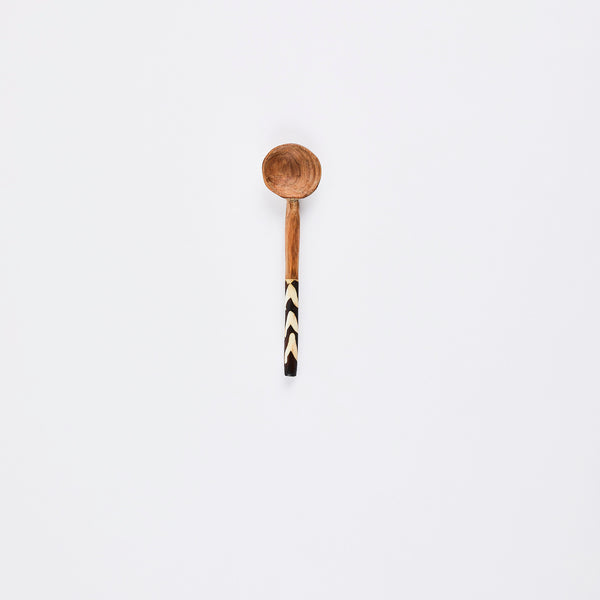 Wooden spoon with tribal print handle.