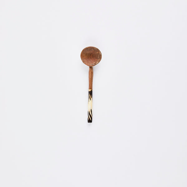 Wooden spoon with tribal print handle.