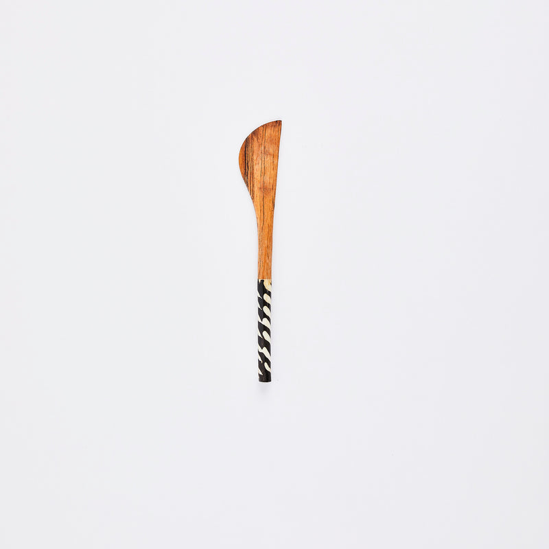 Wooden spoon with tribal print handle.