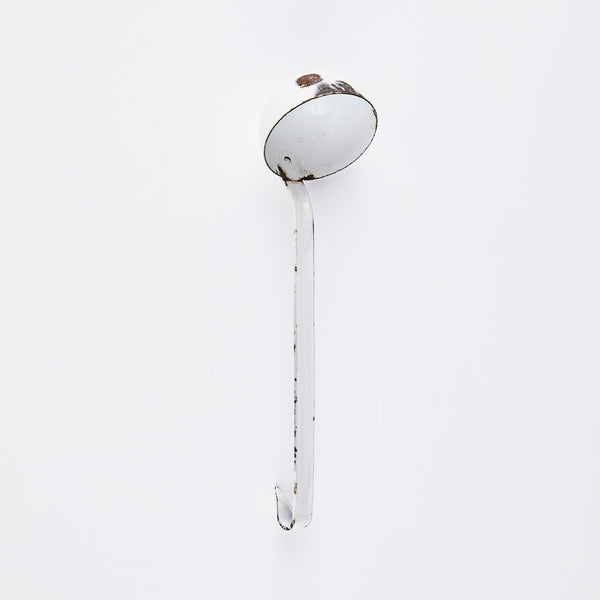 Rustic white metal ladle.