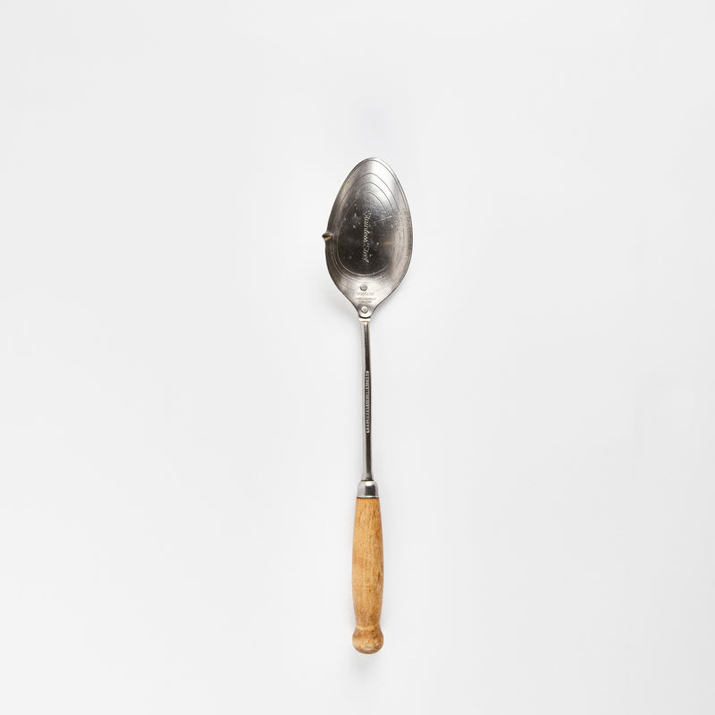 Silver spoon with wooden handle.