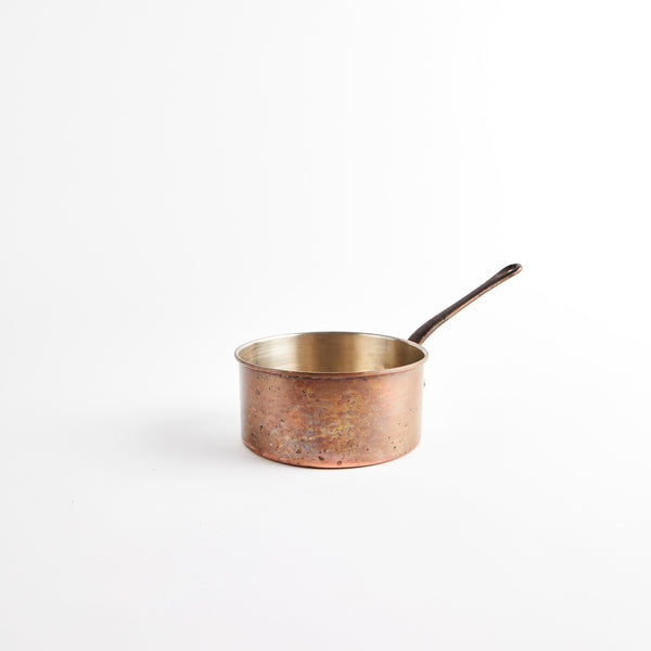 Copper pan with handle.