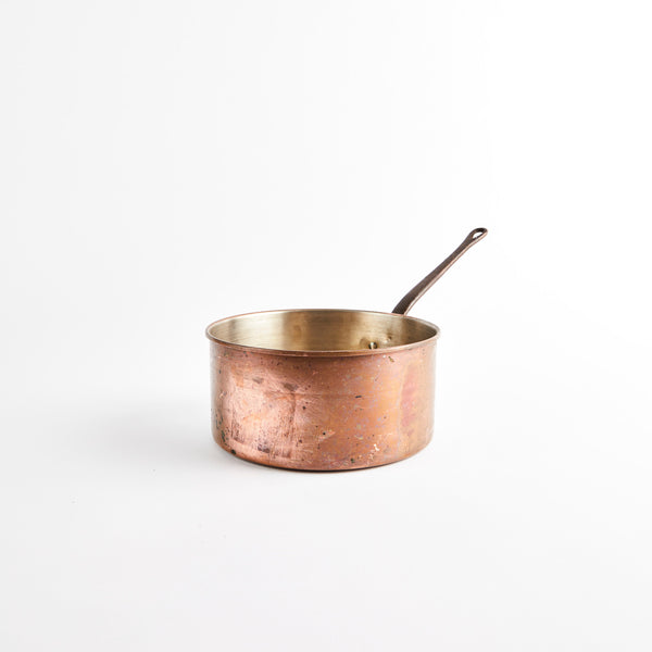 Copper pan with handle.