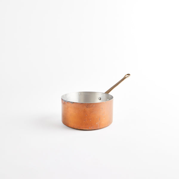 Copper pan with handle.