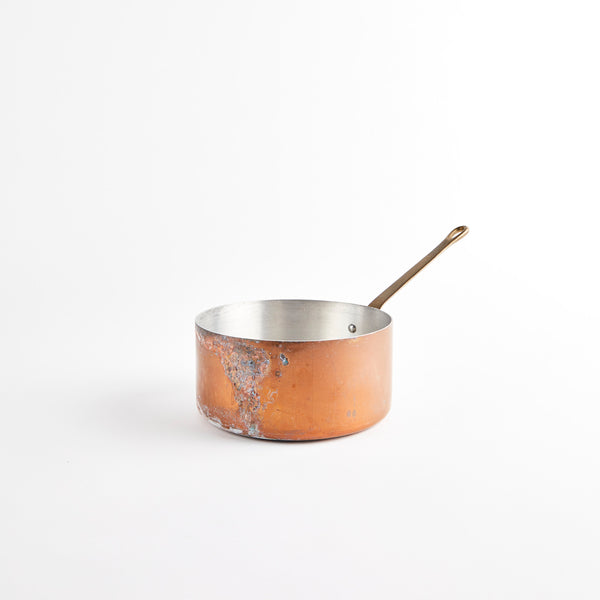 Copper pan with handle.