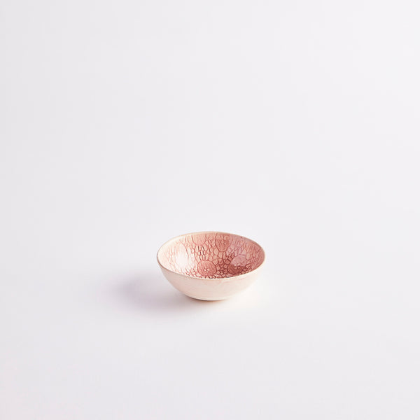 Pink glazed ceramic pinch pot.