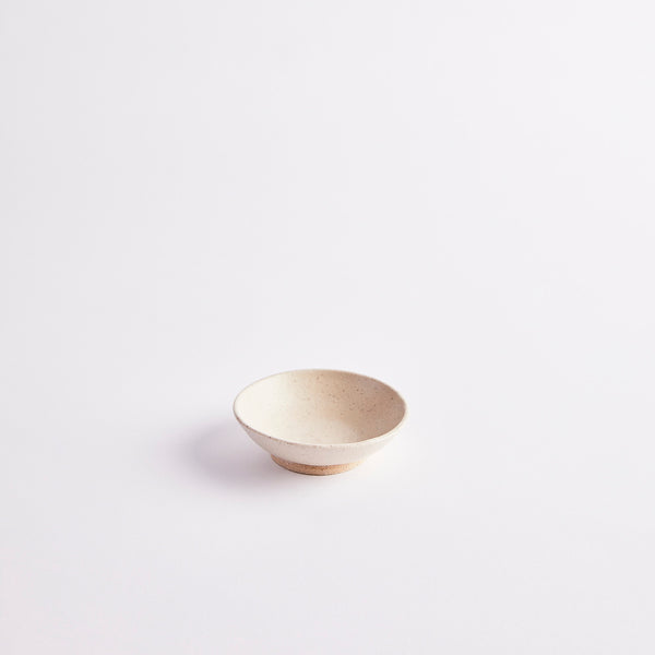 Cream ceramic pinch pot.