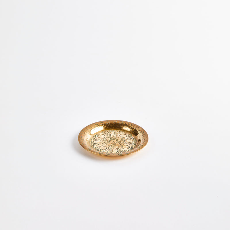 Mini gold brass plate with embossed design.