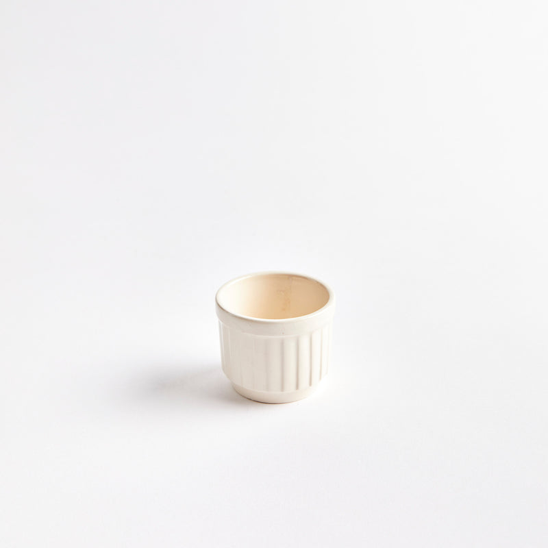 Cream ceramic pinch pot.