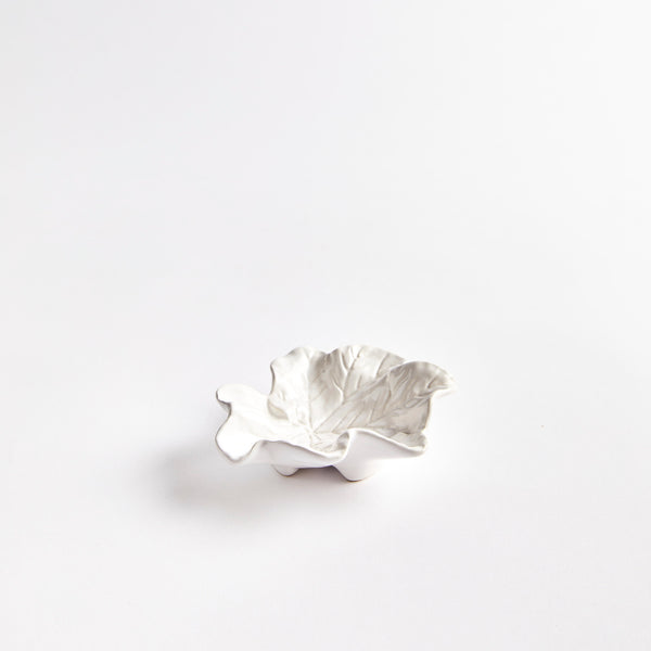 White ceramic leaf shaped pinch pot.