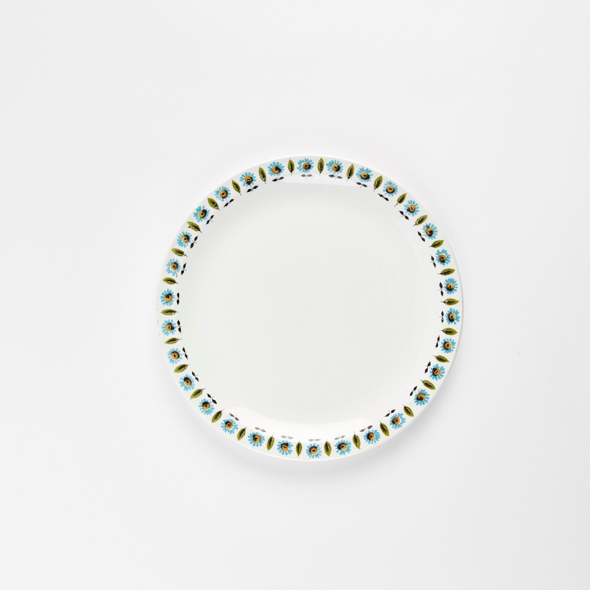 White plate with flower leaf print the social kitchen