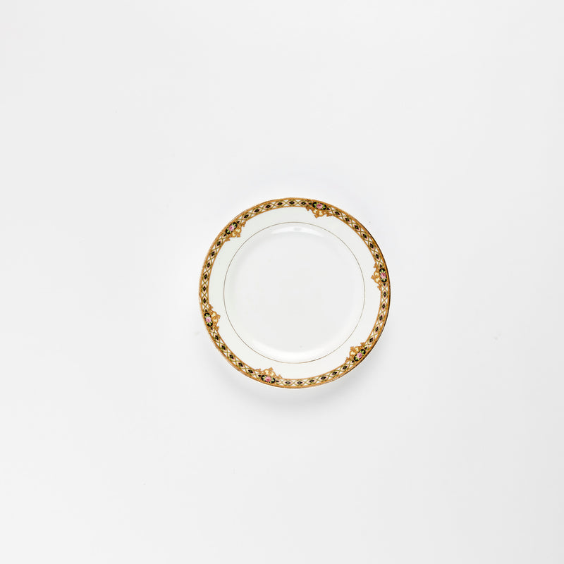 White plate with gold and black detail rim.
