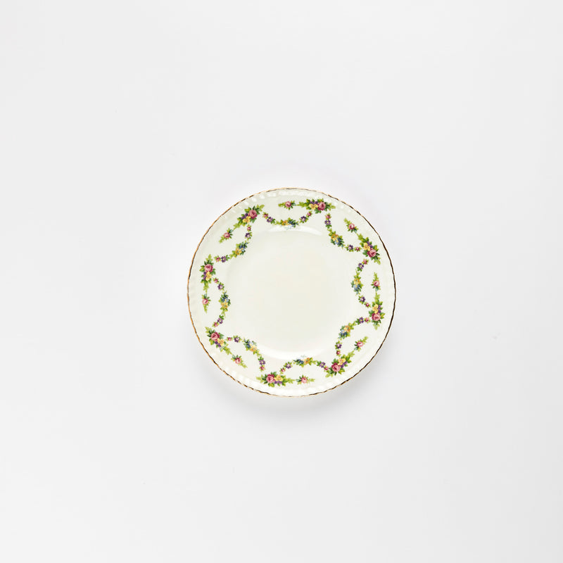 White plate with multicolour floral detail.