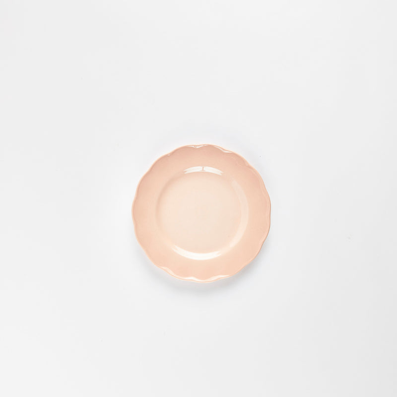 Pink scallop edge plate.