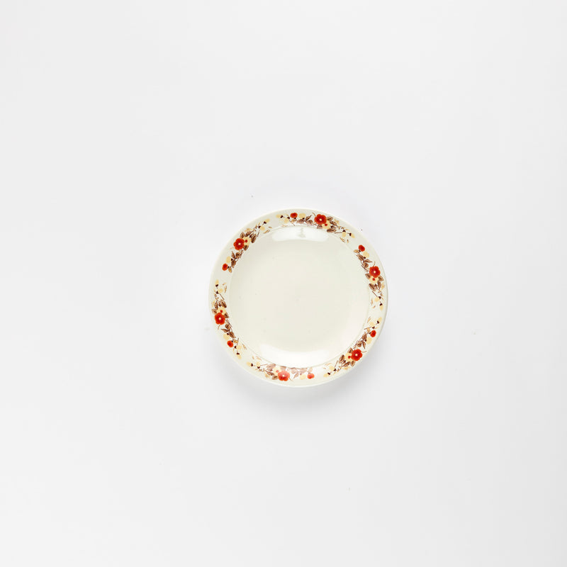 White plate with flower rim. 