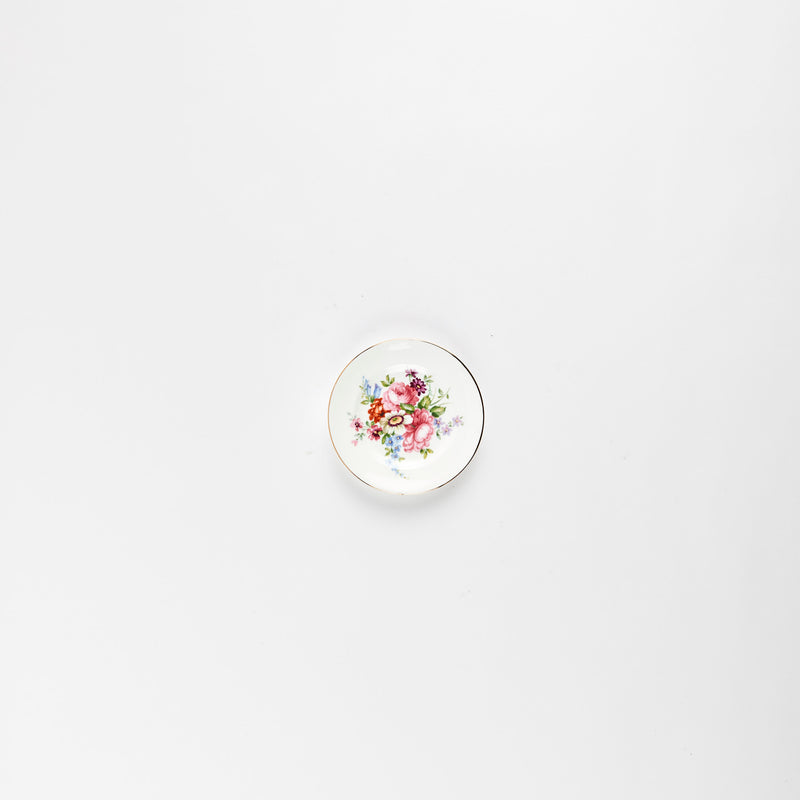 White plate with multicolour flower detail.
