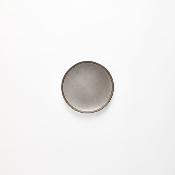 Grey plate with dark rim.