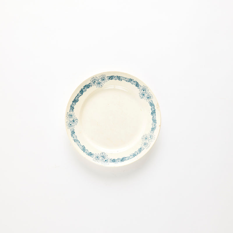 Cream with blue floral decorative edge plate.