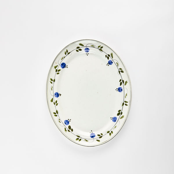 White with green leaf and blue flower rim detail platter.