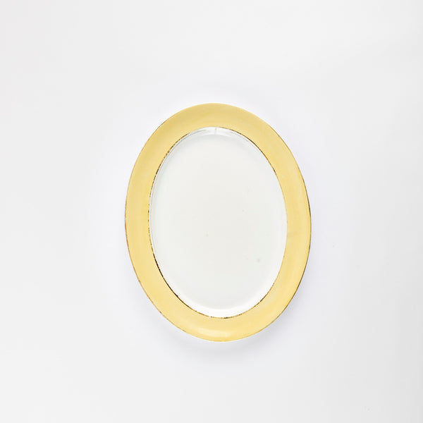 White platter with yellow rim.