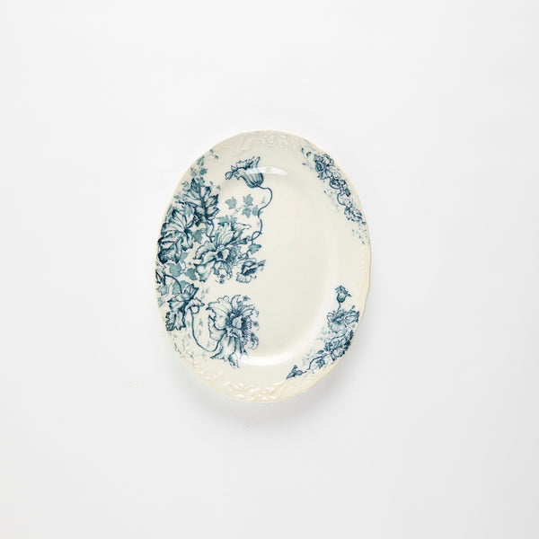 Cream vintage platter with blue floral design.