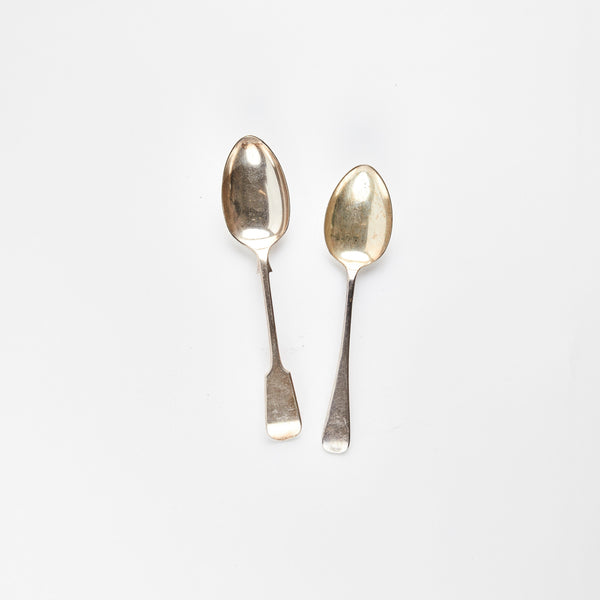 Two silver serving spoons.