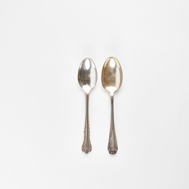 Two silver serving spoons.