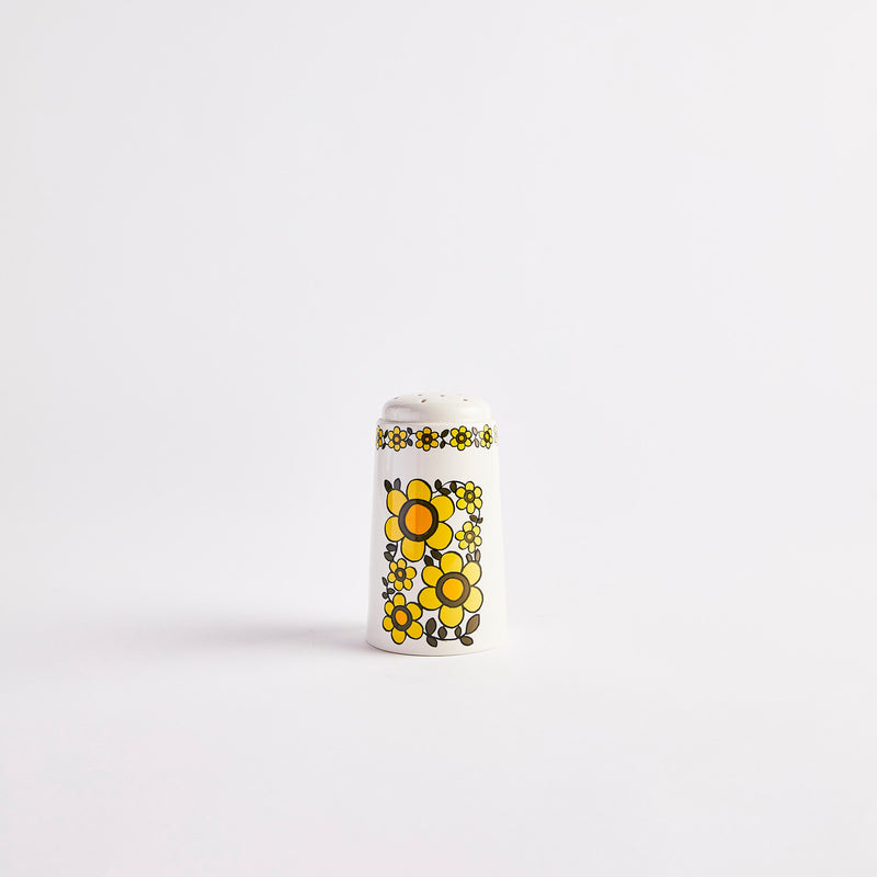 White with yellow flower design shaker.