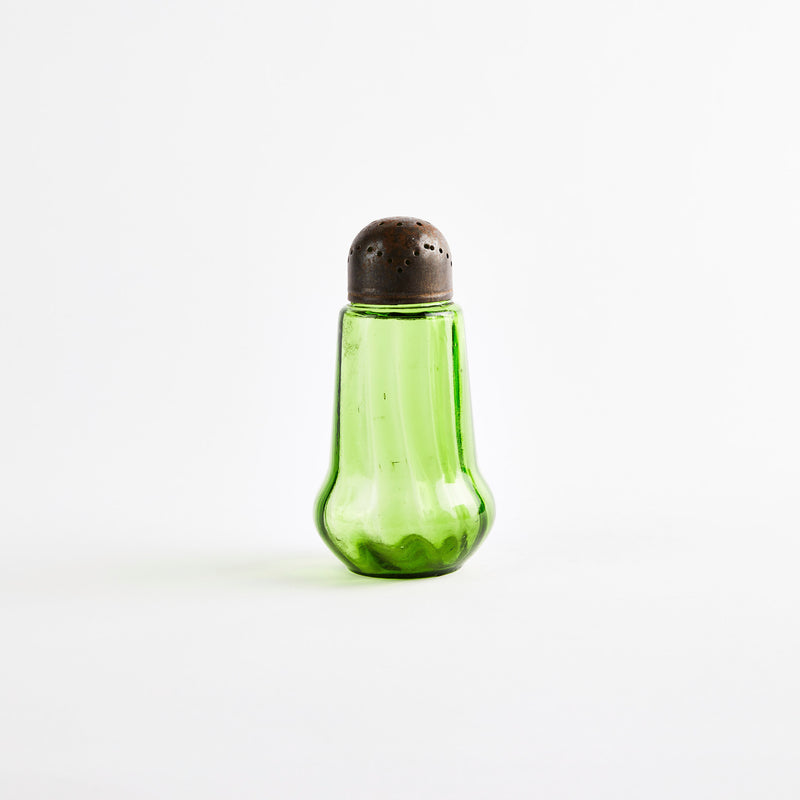Green glass shaker.