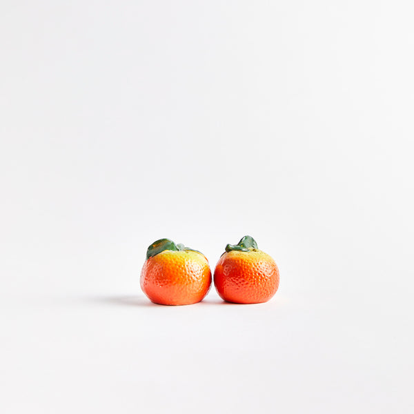 Orange fruit shaped shakers.