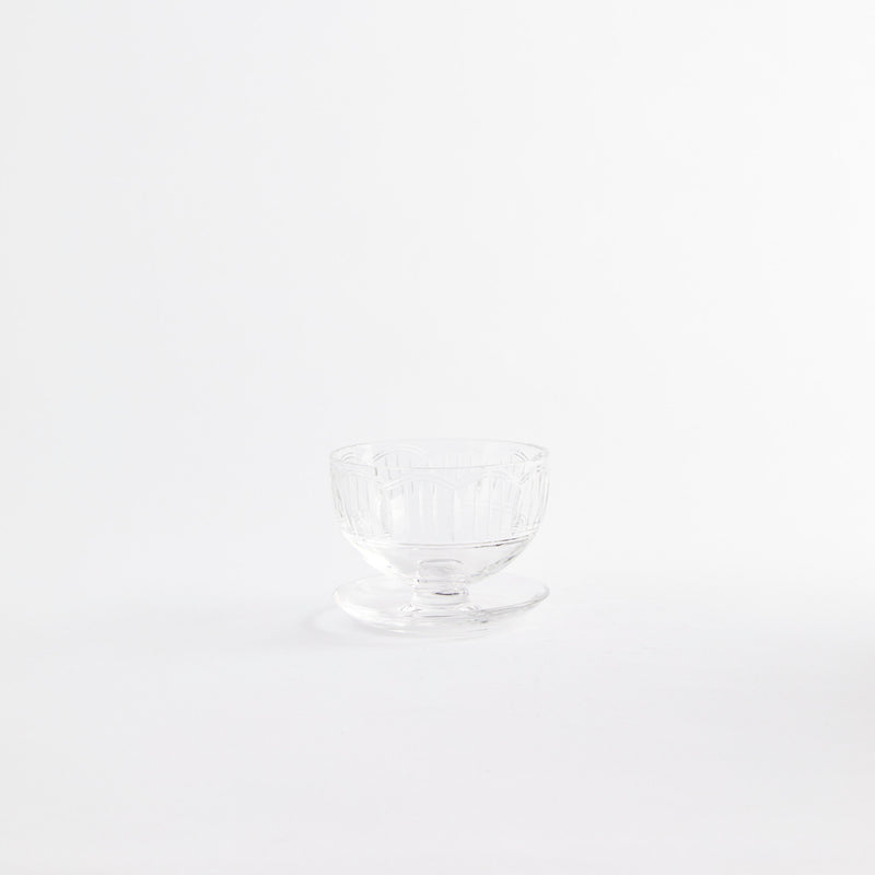 Clear sundae glass with embossed design.