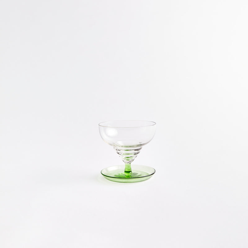 Clear sundae glass with green base.