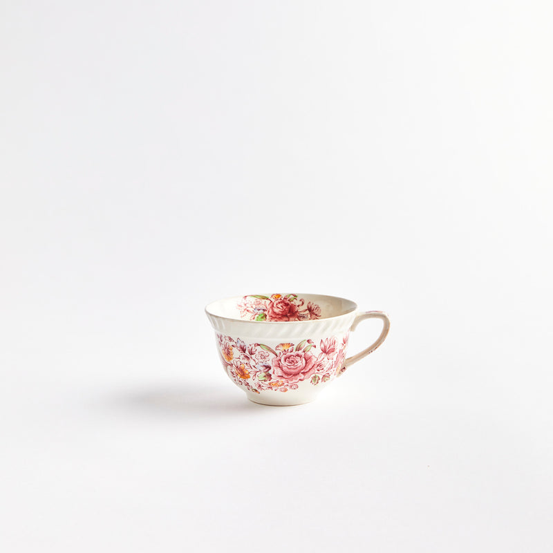 White teacup with pink flowers.