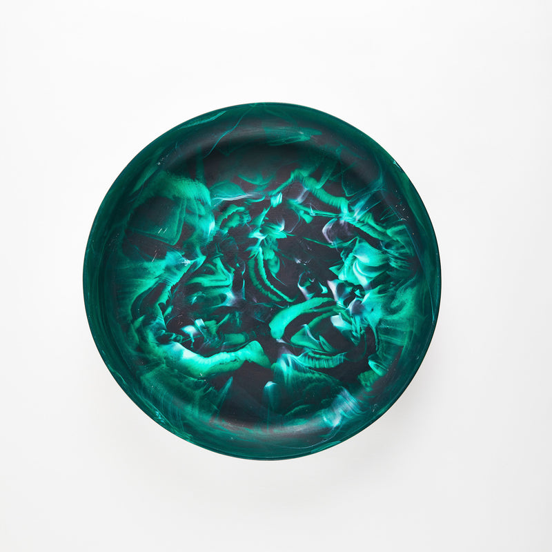 Green marbled circular resin tray.