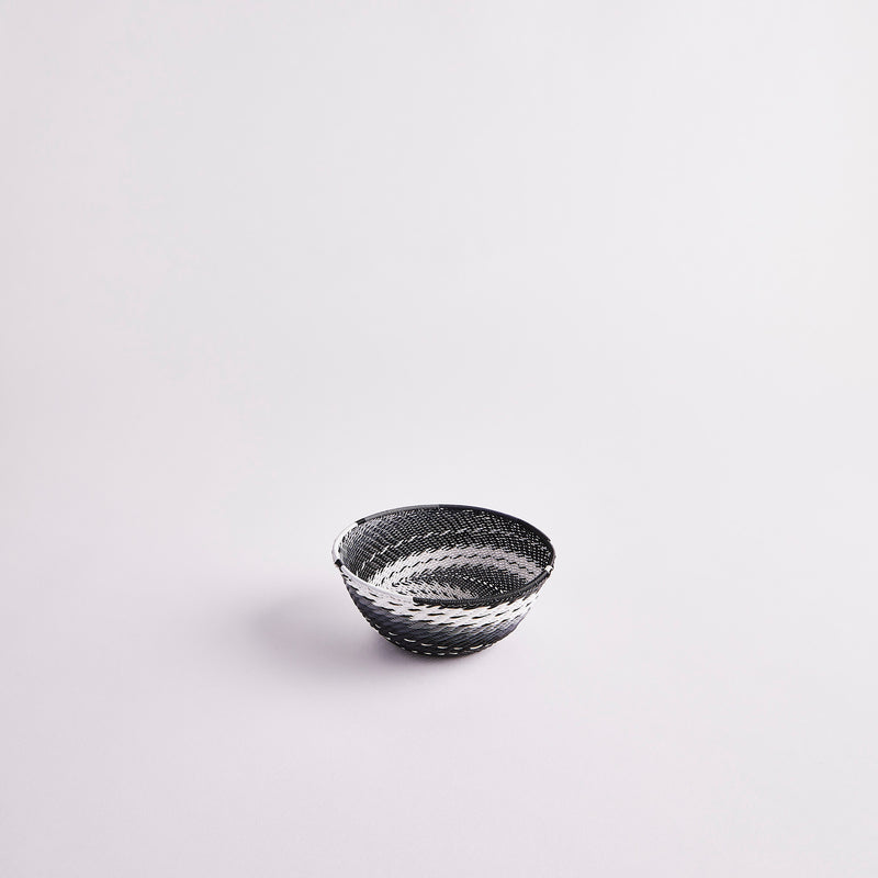Black and white woven basket.