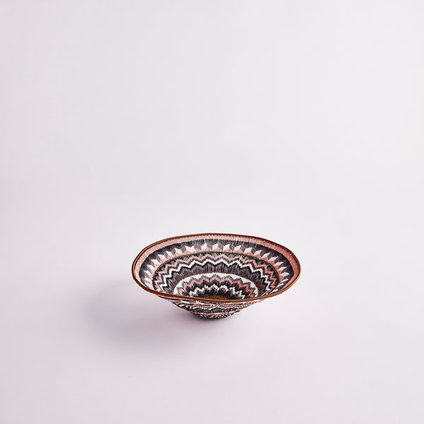 Pink, copper and purple woven basket.